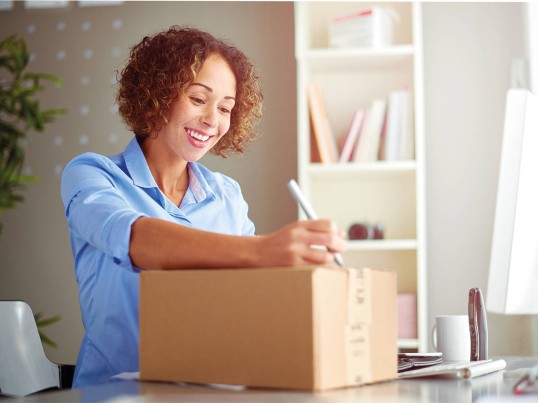 Woman smiling at package