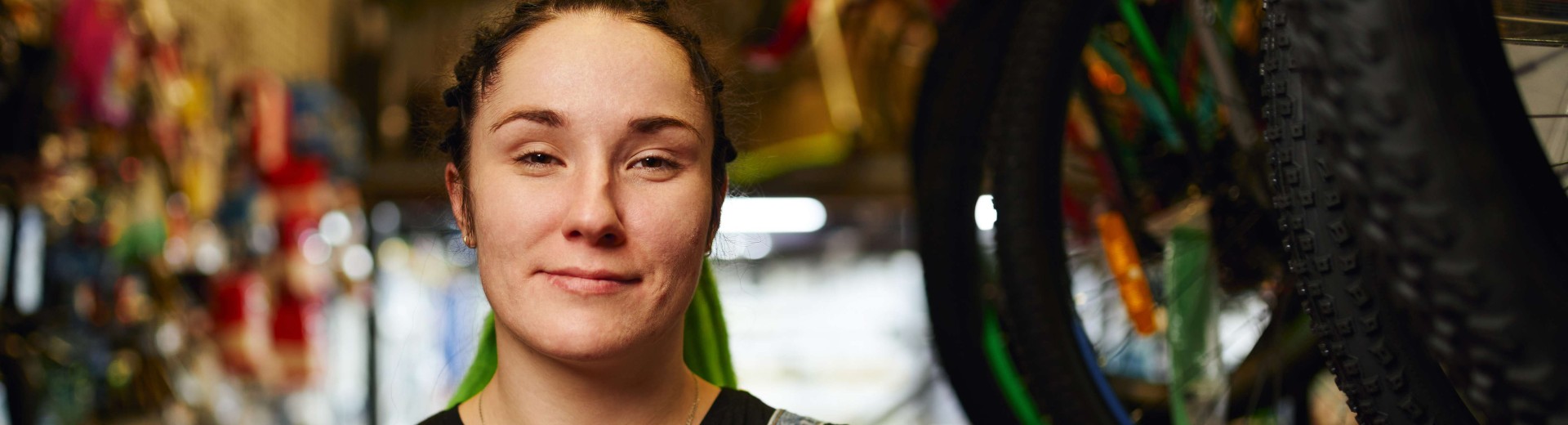 Happy_female_millennial_standing_in_gls_store