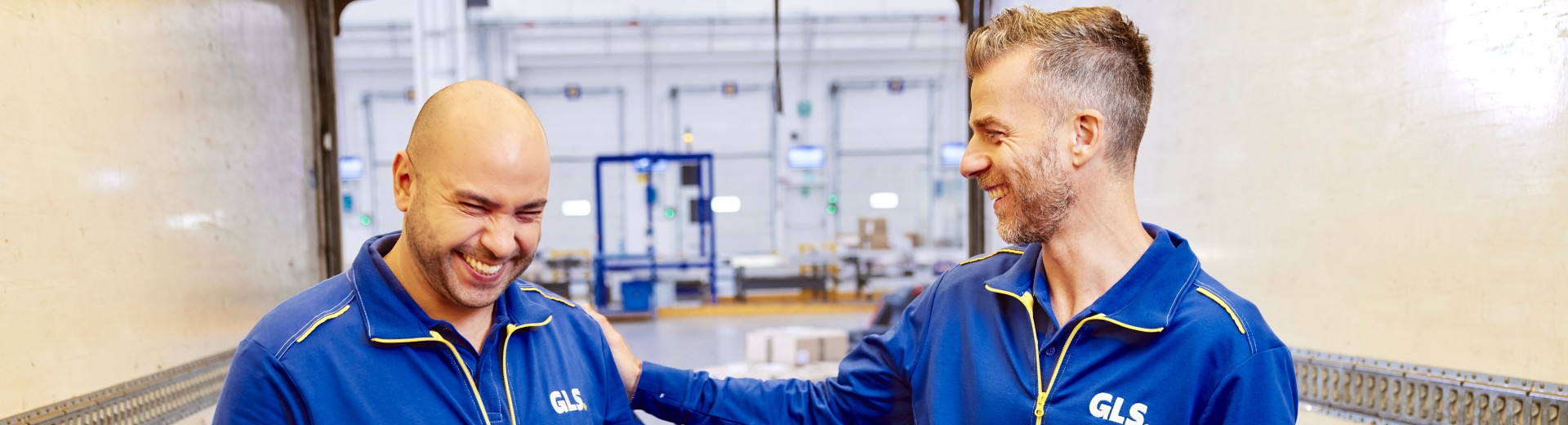 Two employees laughing